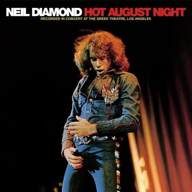 Singer-songwriter Neil Diamond performing on stage.