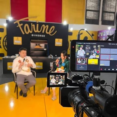 A camera filming an event for a live broadcast.