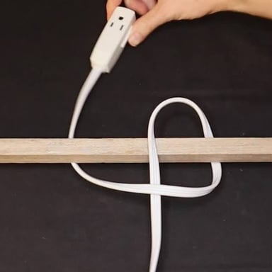 Several cords twisted and knotted together in a tangle.
