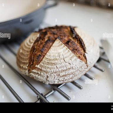 A loaf of bread fresh from the oven, illustrating an enticing aroma.