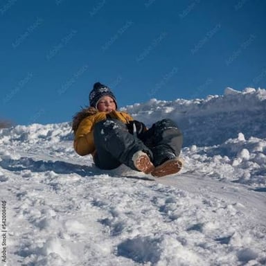 A sled gliding downhill over snow.