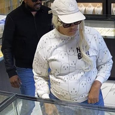 A thief and accomplice near stolen jewelry, illustrating criminal assistance.