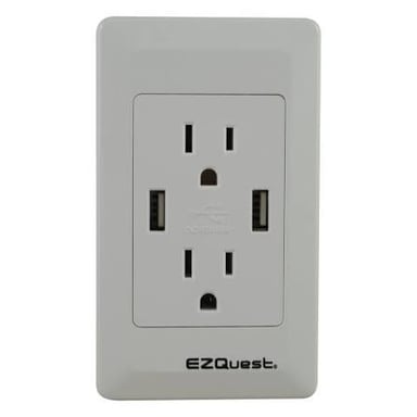 A plug inserted into a household electrical wall outlet.