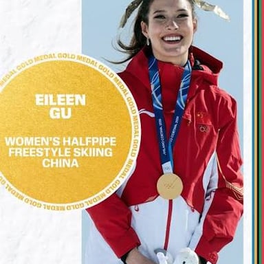 Freestyle skier Eileen Gu celebrating an Olympic medal.