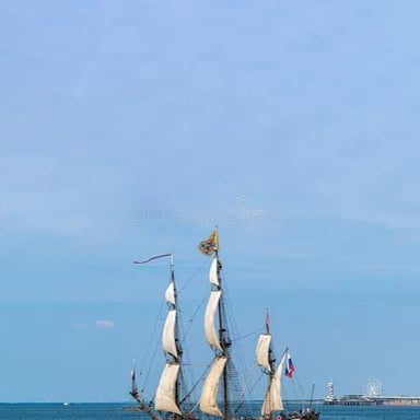 A ship sailing away from a harbor
