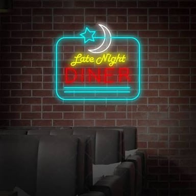 A brightly glowing neon sign outside a diner at night