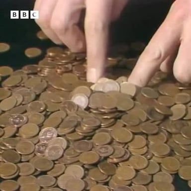 A person gathering a small amount of money to cover expenses