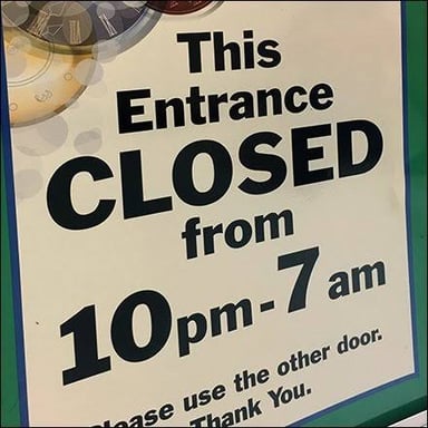 A closed shop entrance, suggesting the store has not opened yet.