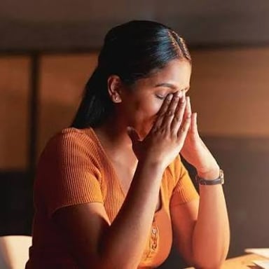 A person with a worried expression, illustrating fretfulness.