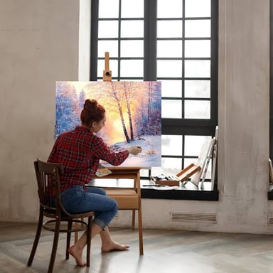 A wooden easel supporting a canvas in an artist’s studio