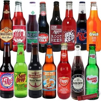 Glasses of fizzy soft drinks with visible bubbles.
