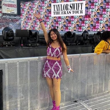 Taylor Swift performing onstage during the Eras Tour.