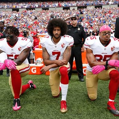 Colin Kaepernick kneeling during a national anthem protest.