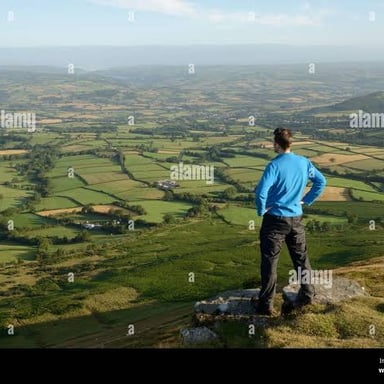 A person looks across a landscape to understand its layout