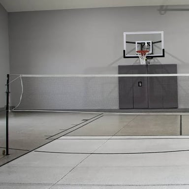 A badminton net dividing a court.
