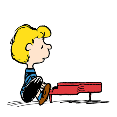 Schroeder, the Peanuts character, seated at his small piano.