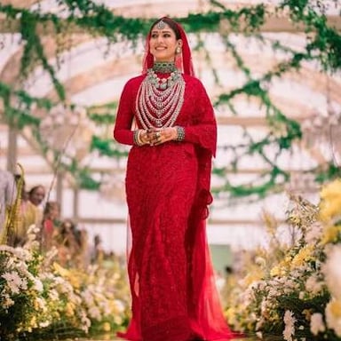 A red sari worn as South Asian wedding attire.