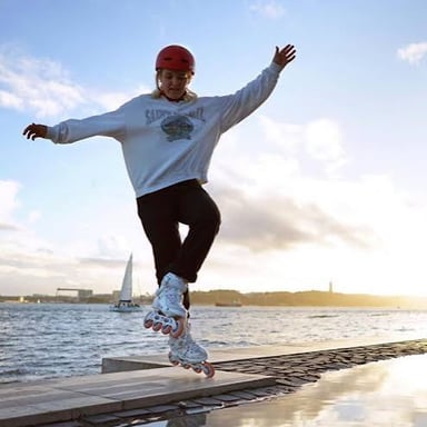 Skaters gliding on wheels and on ice, illustrating the two senses of skate.