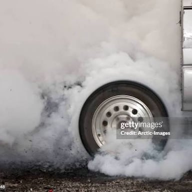 Smoke from burning rubber, an example of a pungent, acrid odor.