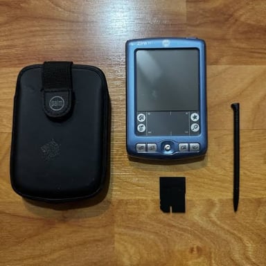 A vintage Palm personal digital assistant handheld device