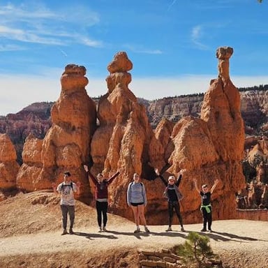 Tall orange hoodoos rise from a natural amphitheater at Bryce Canyon National Park in Utah.