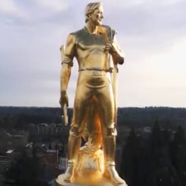 The Oregon State Capitol in Salem, topped by its gold-colored pioneer statue.
