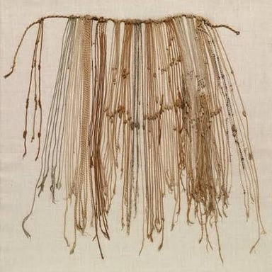 A quipu: cords with carefully arranged knots used for recordkeeping in the Inca Empire.