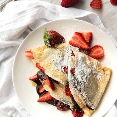 A thin French crepe folded around a chocolate-hazelnut filling.