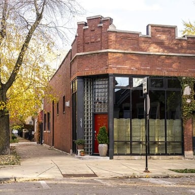 A neighborhood convenience store on a street corner.