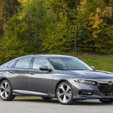 A Honda Accord sedan, illustrating the car type named by the clue.