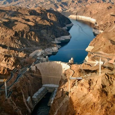 Hoover Dam spans the Colorado River; Xiluodu Dam is a large dam on China's Jinsha River.