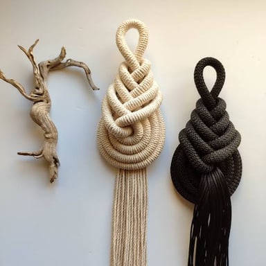 A decorative macramé piece made from knotted cord