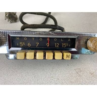Car radio showing saved preset station buttons