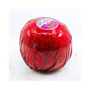 A round Edam cheese with its recognizable red wax coating.