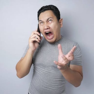 A person reacting with mild surprise during a conversation.
