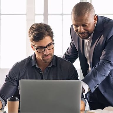 An office worker at a desk representing someone temporarily filling in for a regular employee.