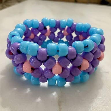 Colorful handmade bead bracelets, often worn or exchanged at raves.