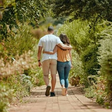 Two people enjoying a romantic walk together, illustrating courtship.