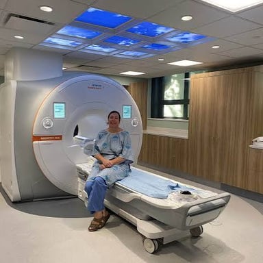 A hospital MRI scanner with its circular opening and patient table