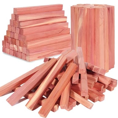 Evergreen cedar foliage beside cedarwood blocks used for storage.