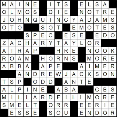 Person constructing a crossword puzzle on paper