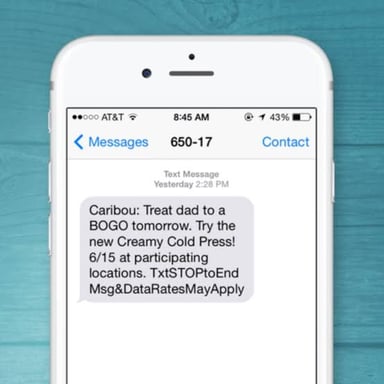 A phone text message showing informal letter-and-number-style abbreviation