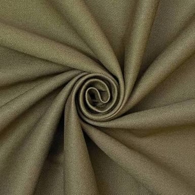 A close-up view of the diagonally woven texture of chino cotton twill.
