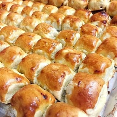 A savory potato knish displayed at a kosher deli