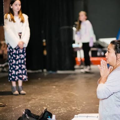 A performer reading lines at an audition.