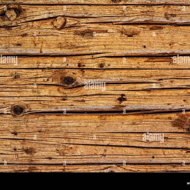 A weathered wooden surface showing wear from use.