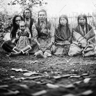 A historical photograph showing members of the Arapaho people.