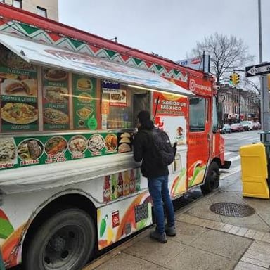 A taco truck serving food on a city street