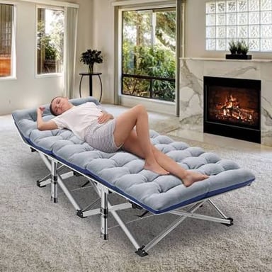 A simple folding cot with fabric stretched across a frame.