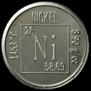 A silvery piece of nickel metal, a corrosion-resistant chemical element.